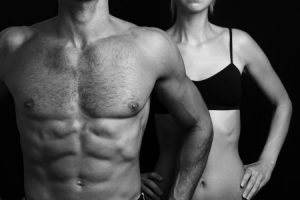 45164761 - bodybuilding, sport, fitness ,workout concept. fit couple, strong muscular man and slim woman posing on a black background